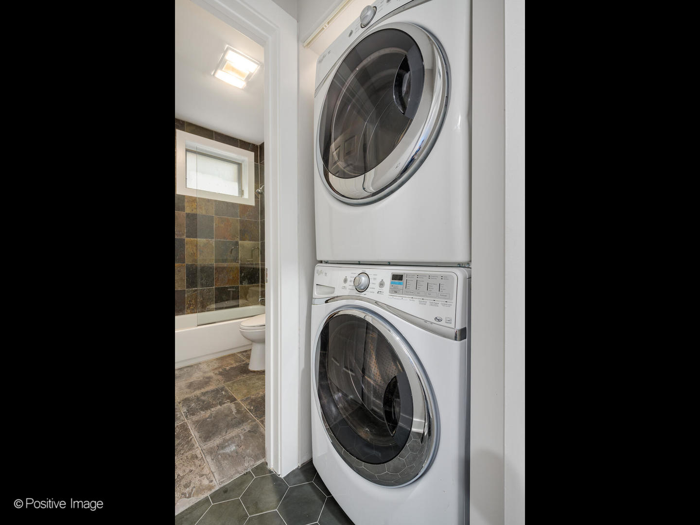 1834 West Rice Street, Unit A Chicago, IL 60622 - Photo 20 of 23 a view of a hallway with washer and dryer
