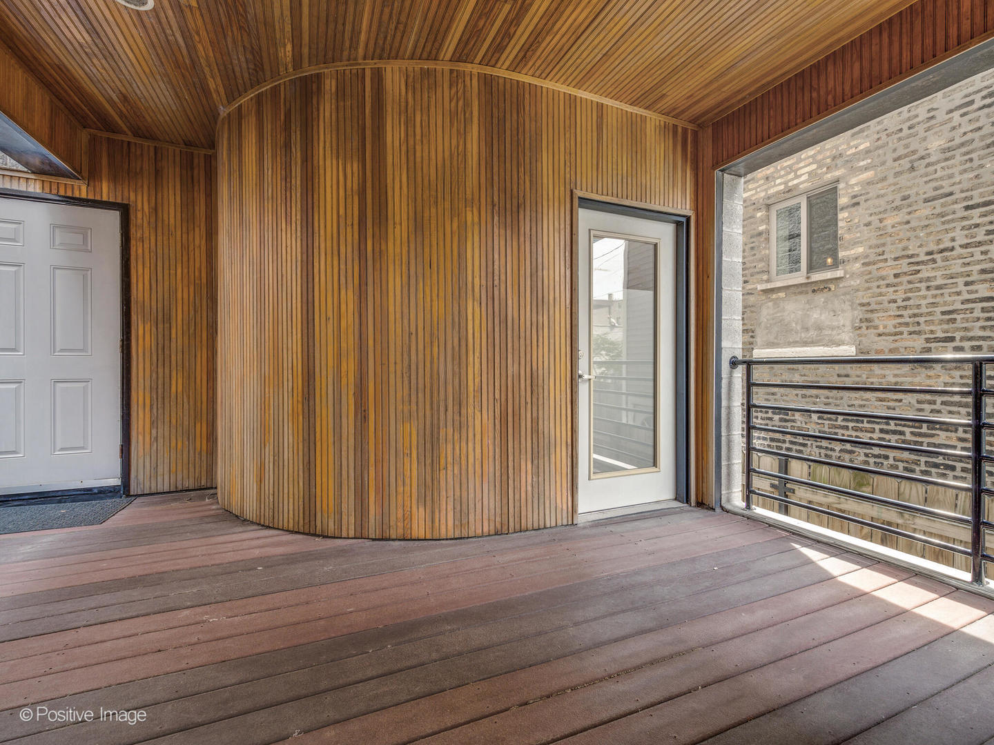 1834 West Rice Street, Unit A Chicago, IL 60622 - Photo 23 of 23 an empty room with wooden floor and windows