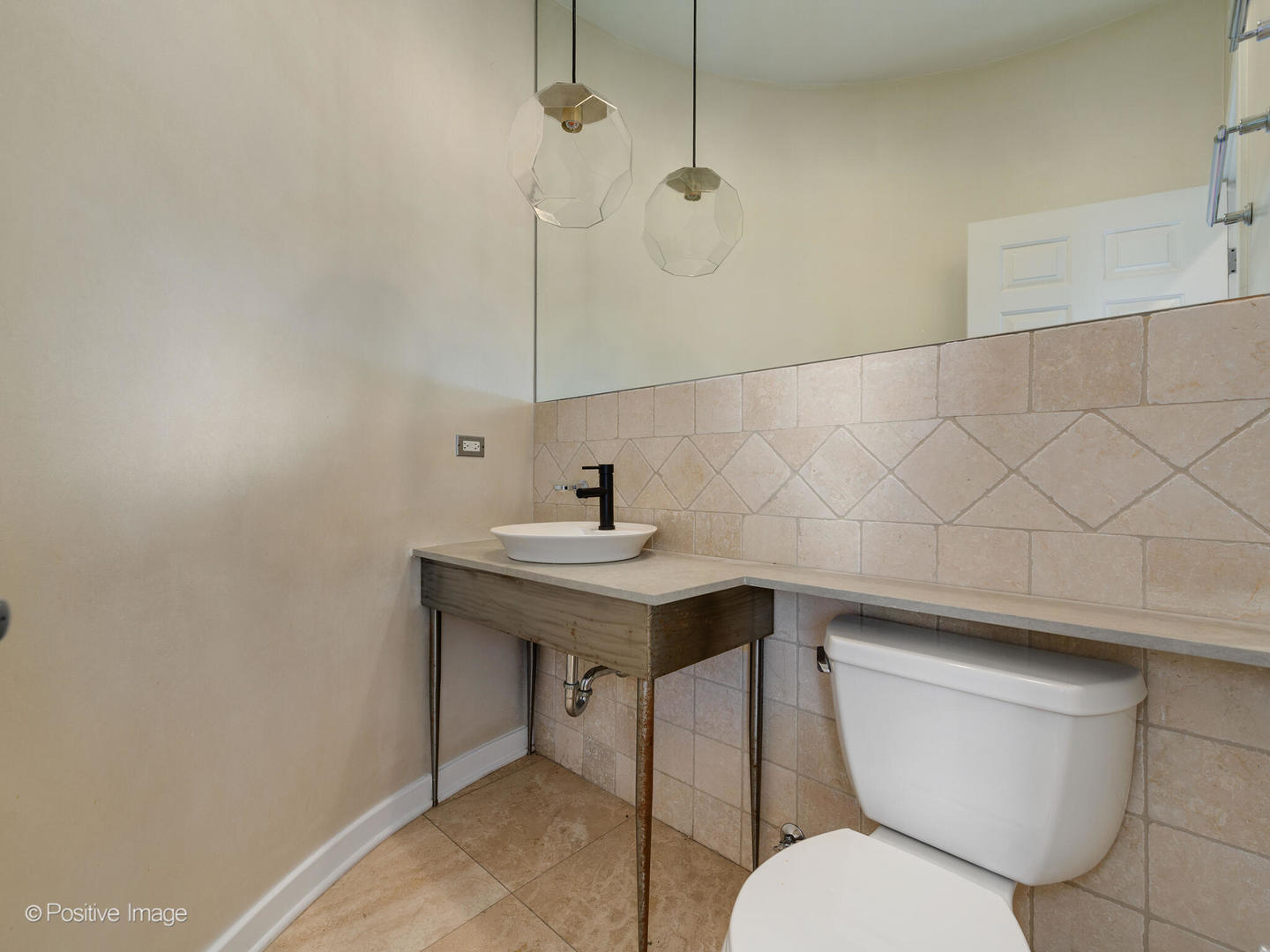 1834 West Rice Street, Unit A Chicago, IL 60622 - Photo 8 of 23 a bathroom with a sink a toilet and mirror