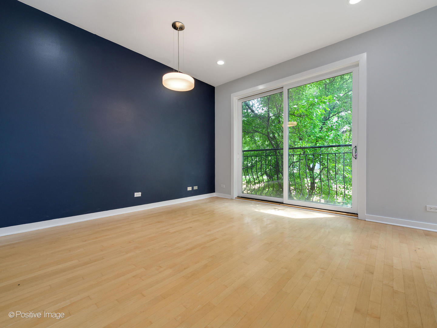 1834 West Rice Street, Unit A Chicago, IL 60622 - Photo 10 of 23 a view of an empty room with a window and kitchen view