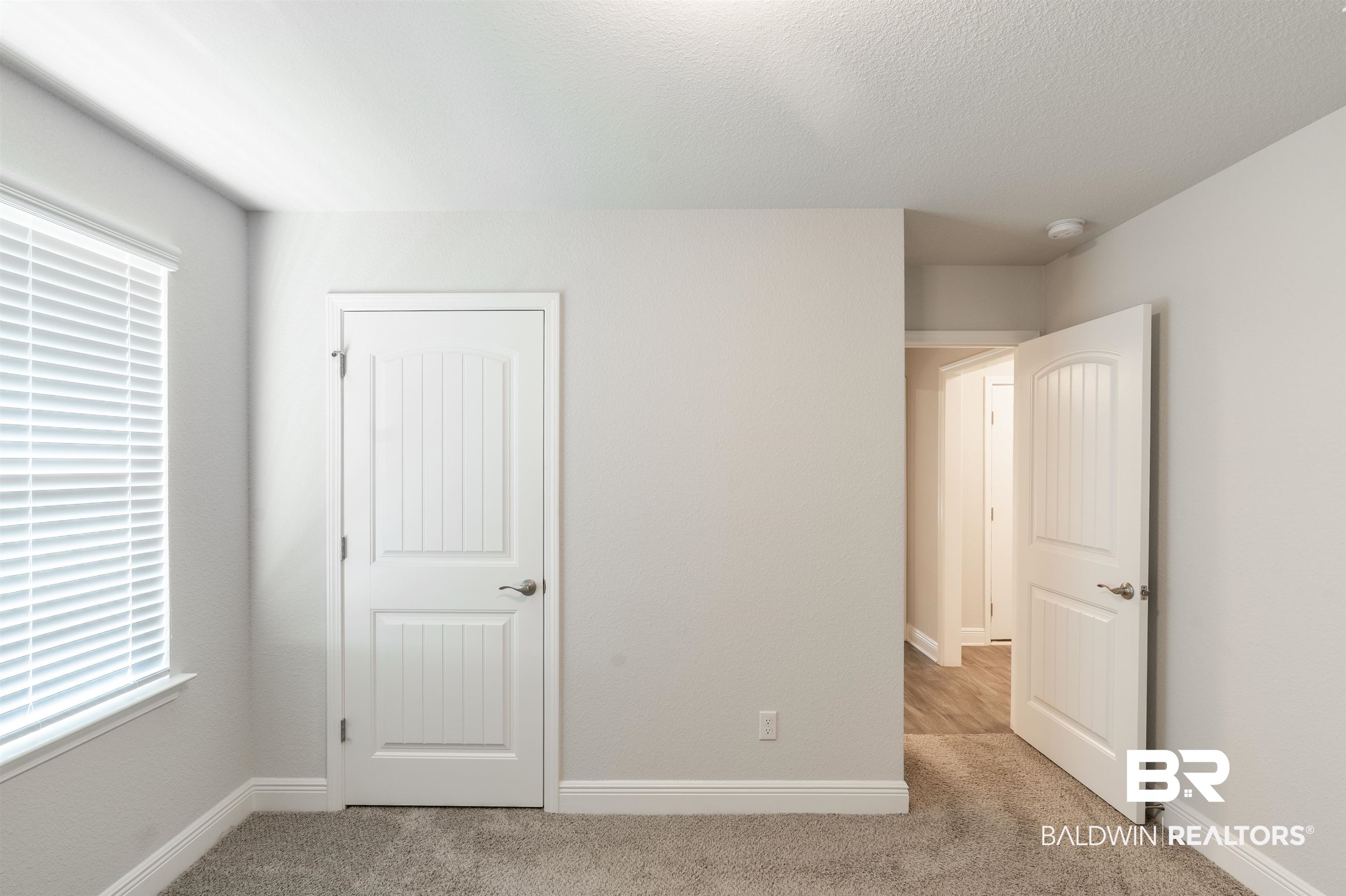 1906 Stonepine Drive South Semmes, AL 36575 - Photo 17 of 30 Unfurnished bedroom featuring light carpet and a textured ceiling