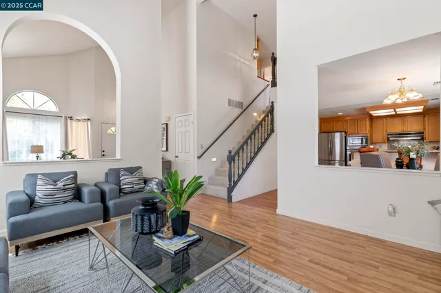 a dining room with furniture a fireplace and wooden floor