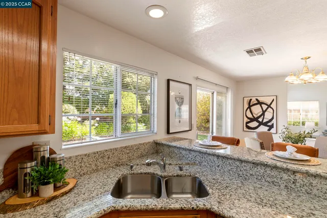 a dining room with furniture window and wooden floor