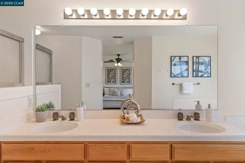 a bathroom with a shower and a mirror