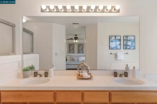 a bathroom with a shower and a mirror
