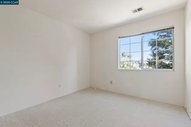 a bathroom with a shower and a window