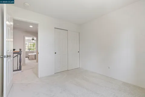 a bathroom with a sink vanity granite and a mirror