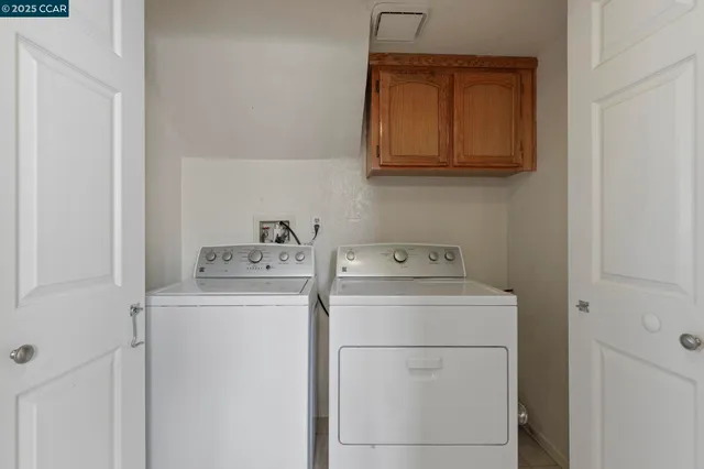 a view of a chair and table in the patio