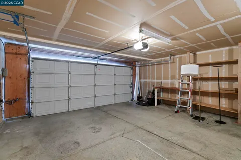 a outdoor living space with furniture potted plant and a glass door