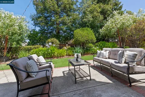a front view of house with yard and outdoor seating