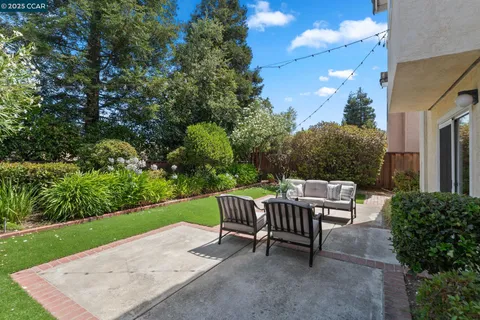a view of a swimming pool and lounge chairs
