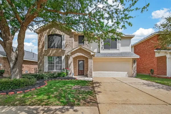 a bathroom with a granite countertop sink a mirror and a shower