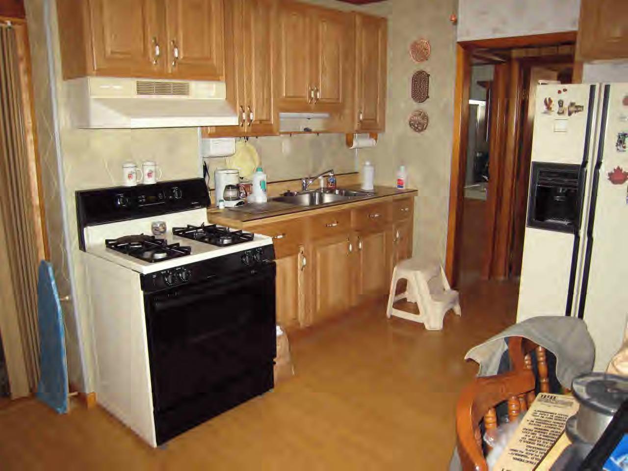 146 River Road Monroe, MA 01350 - Photo 6 of 8 a kitchen with stainless steel appliances granite countertop a refrigerator and a stove
