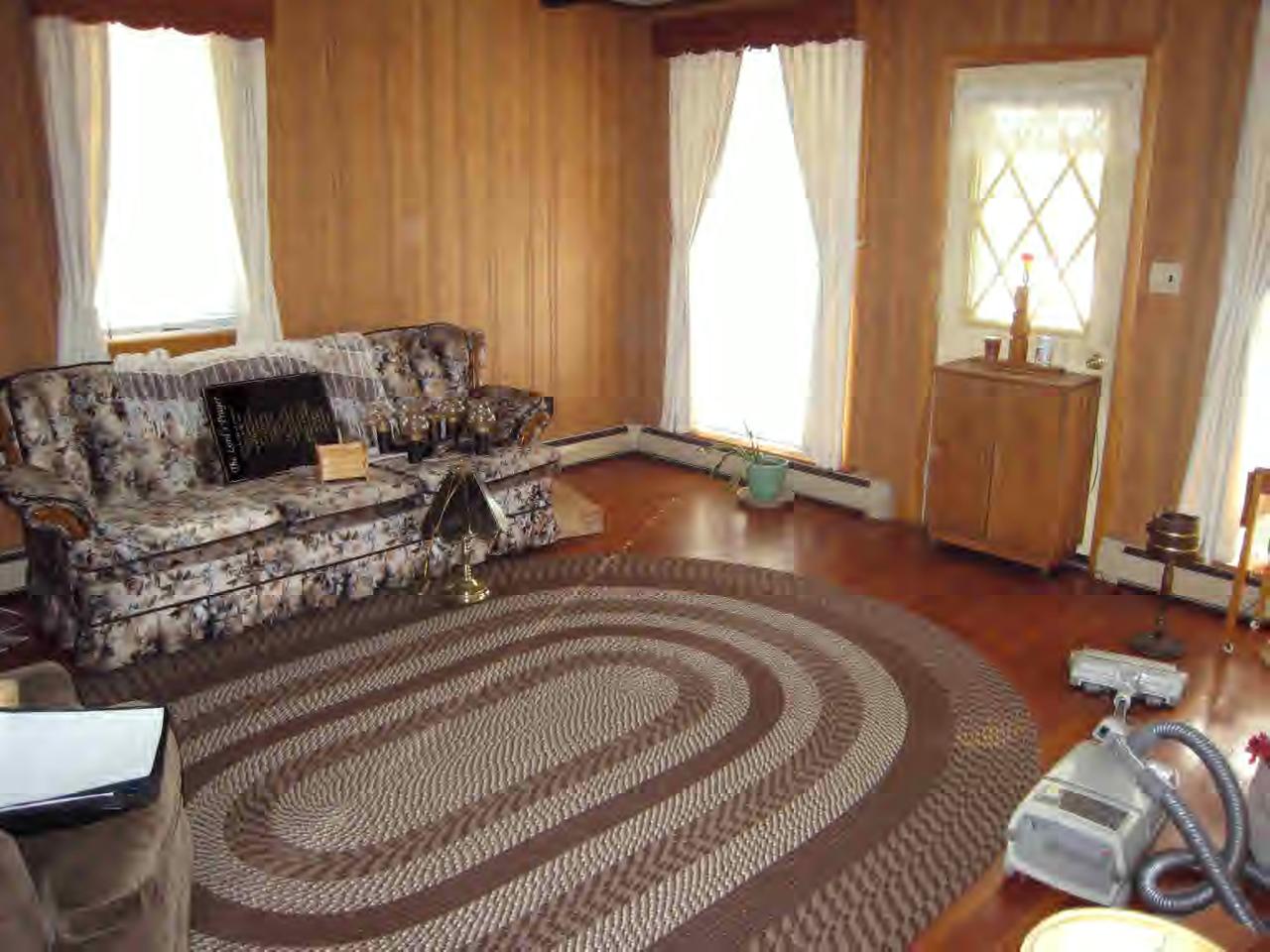 146 River Road Monroe, MA 01350 - Photo 7 of 8 a living room with furniture and a fireplace