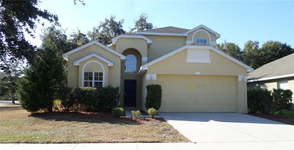 11718 Colony Lakes Boulevard New Port Richey, FL 34654 - Photo 1 of 1 a front view of a house with garden