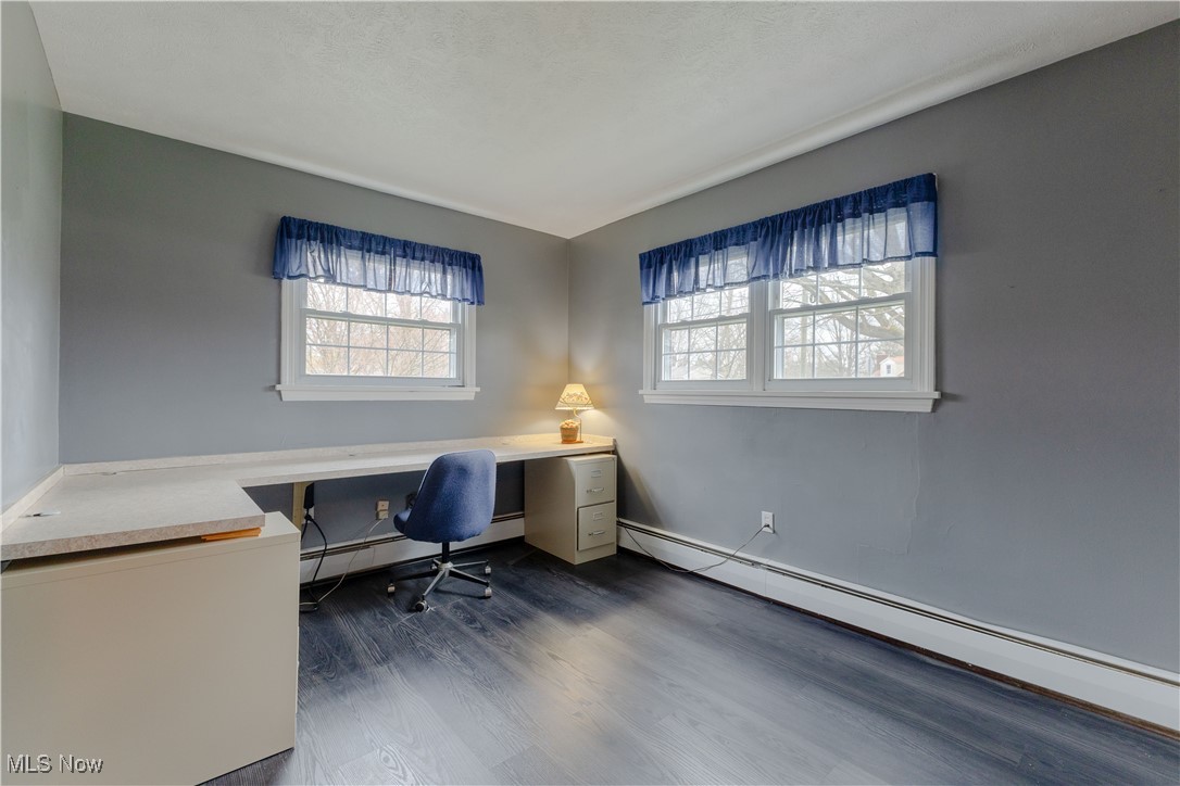 1639 South Ridge Road West Ashtabula, OH 44004 - Photo 14 of 44 Office area with a baseboard radiator and dark wood finished floors