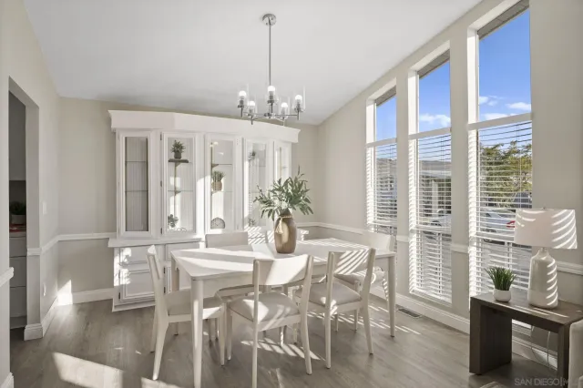 a view of a dining room with furniture window and wooden floor