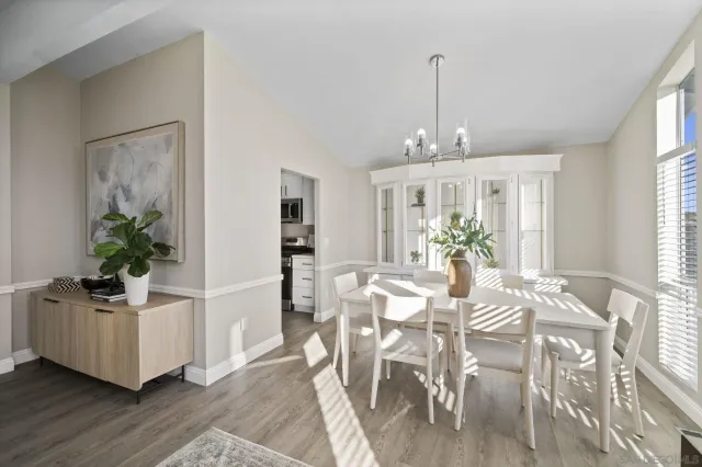 a view of a dining room with furniture and window