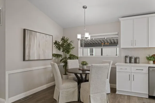 a dining room with furniture and window