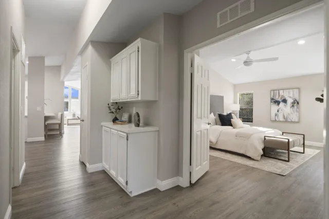 a view of living room with furniture and wooden floor