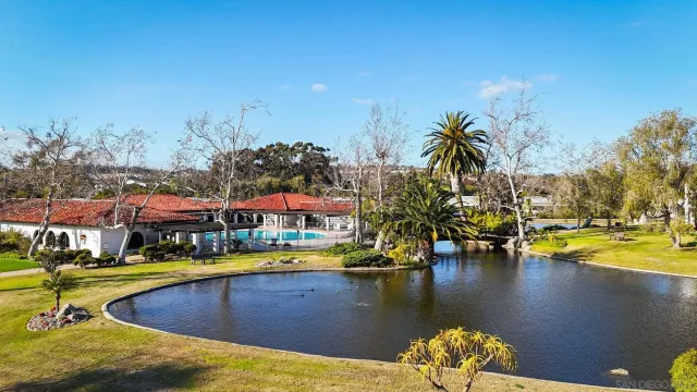 a view of a swimming pool with outdoor seating