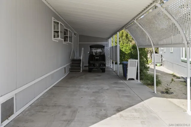 a view of an empty room with a fireplace