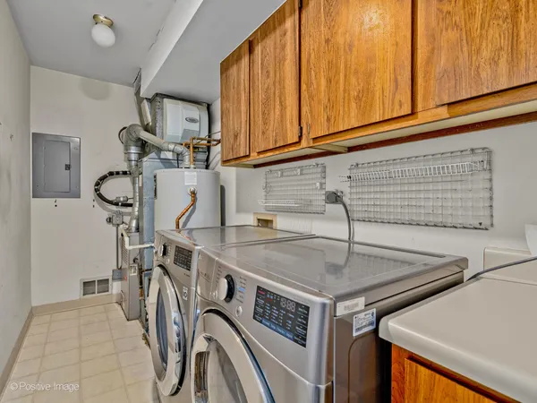 a kitchen with a sink a stove and cabinets