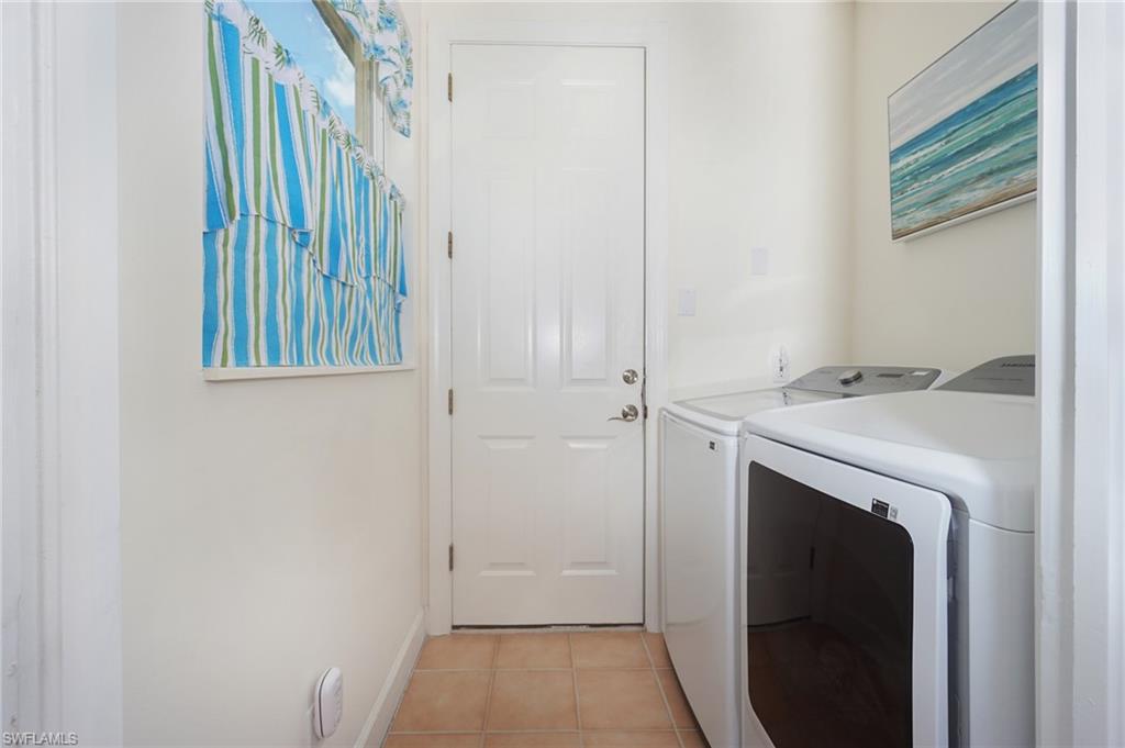 922 Turtle Court Naples, FL 34108 - Photo 13 of 29 a utility room with a sink dryer and washer
