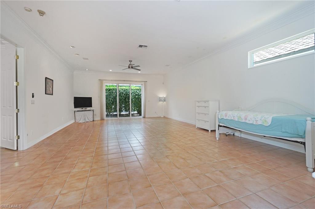 922 Turtle Court Naples, FL 34108 - Photo 16 of 29 a view of an empty room with a window