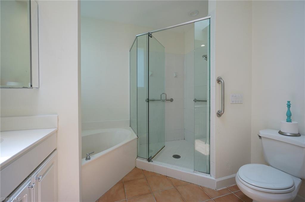 922 Turtle Court Naples, FL 34108 - Photo 21 of 29 a bathroom with a shower a toilet and a sink