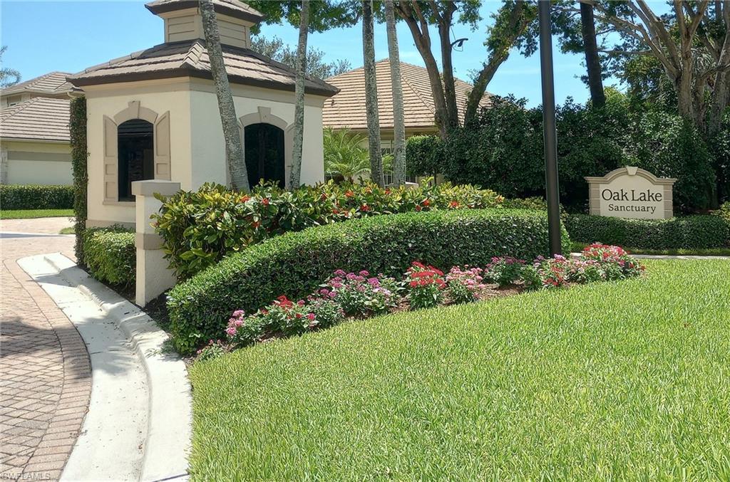 922 Turtle Court Naples, FL 34108 - Photo 28 of 29 a front view of a house with a garden