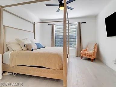 9011 Madrid Circle Naples, FL 34104 - Photo 16 of 20 a bedroom with a bed and glass window