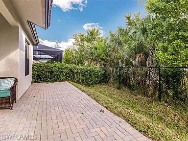 9011 Madrid Circle Naples, FL 34104 - Photo 20 of 20 a balcony with view of outdoor space