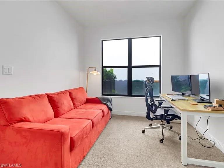 9011 Madrid Circle Naples, FL 34104 - Photo 8 of 20 a workspace with a large window