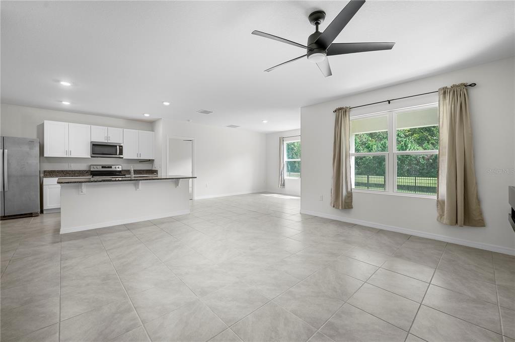 114 Birch Tree Place Daytona Beach, FL 32117 - Photo 12 of 33 a view of a kitchen with a sink and stainless steel appliances