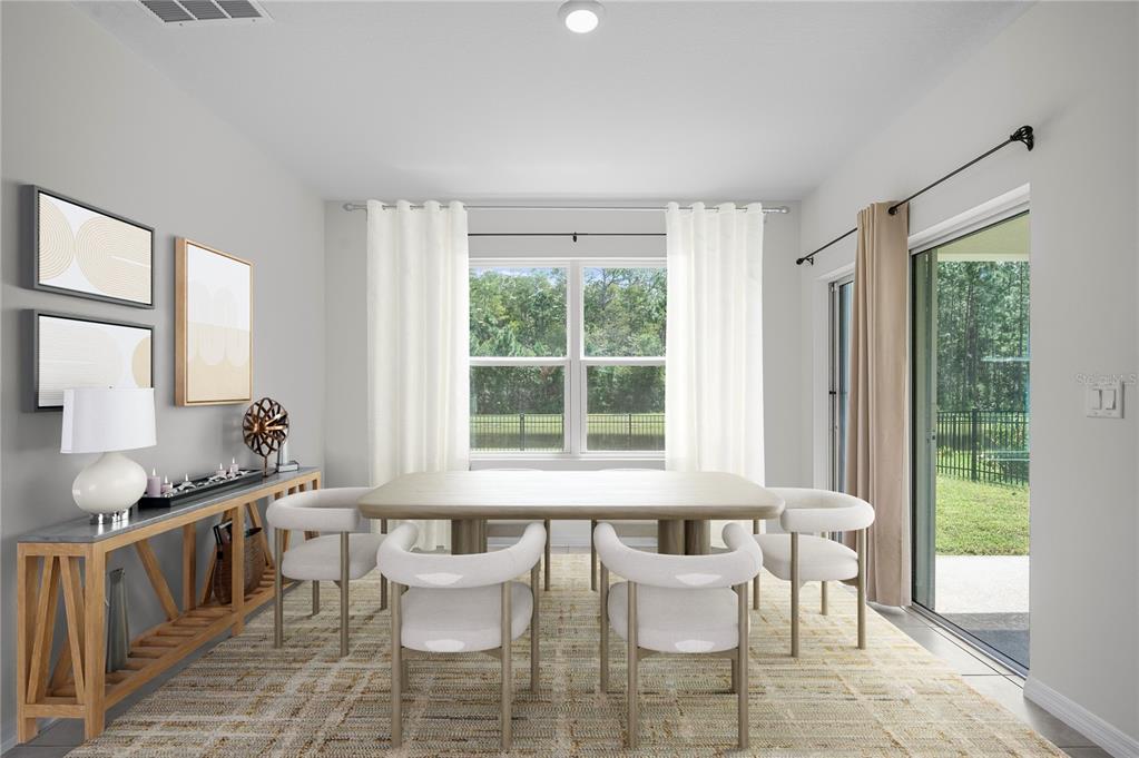 114 Birch Tree Place Daytona Beach, FL 32117 - Photo 13 of 33 a view of a dining room with furniture and windows