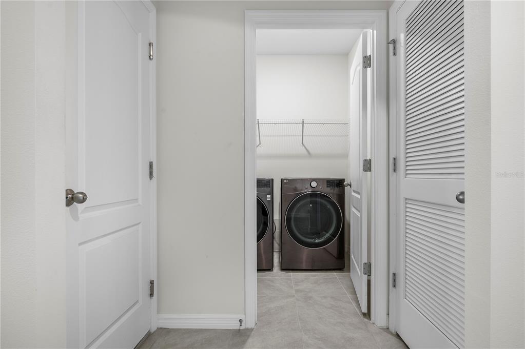 114 Birch Tree Place Daytona Beach, FL 32117 - Photo 27 of 33 a view of a hallway with washer and dryer