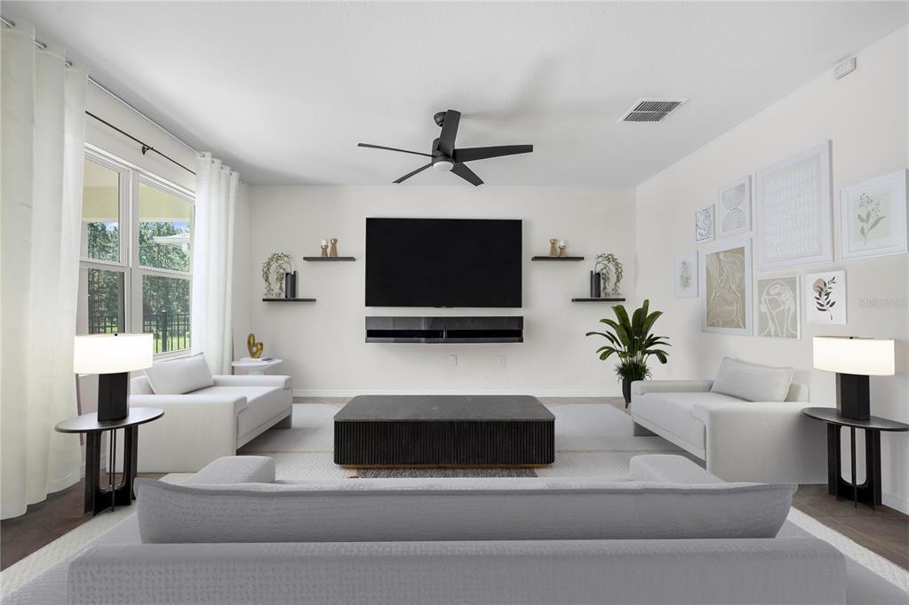 114 Birch Tree Place Daytona Beach, FL 32117 - Photo 10 of 33 a living room with furniture and a flat screen tv