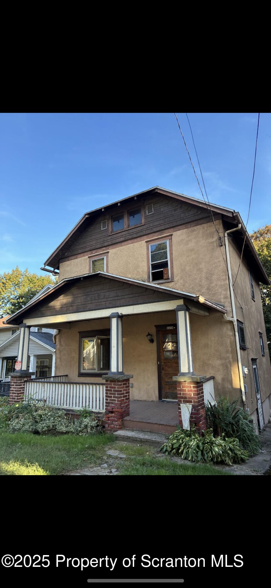 2136 North Main Avenue Scranton, PA 18508 - Photo 1 of 18 a front view of a house with a yard