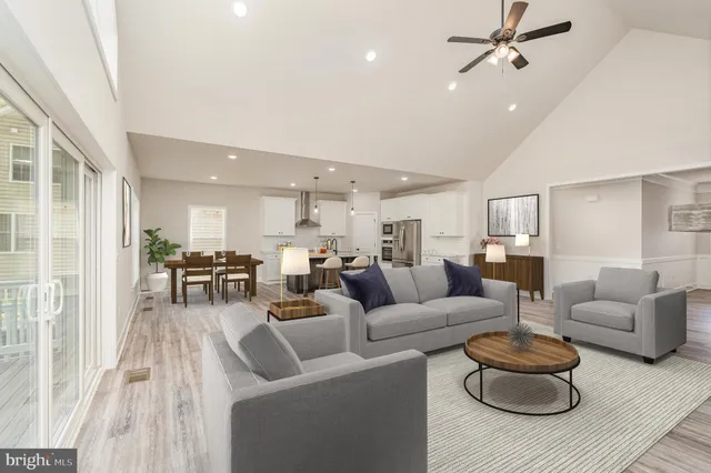 a kitchen with a refrigerator a sink and cabinets