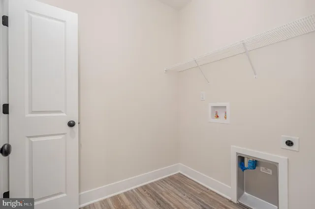 a view of a livingroom with a ceiling fan and window