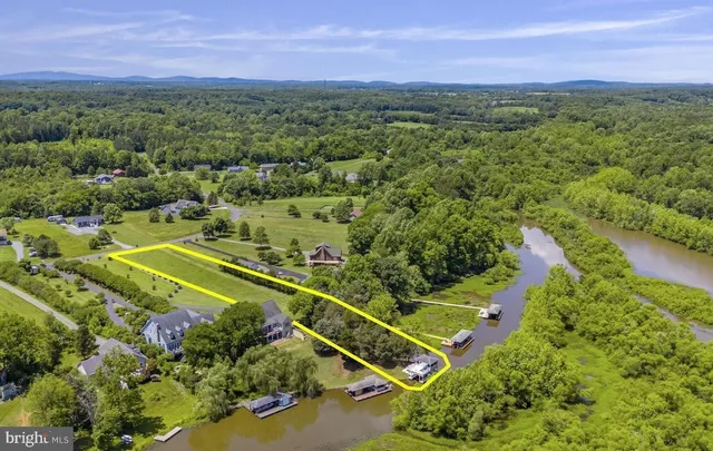 a view of a lake with a house in the background