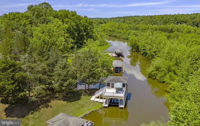 a view of balcony with wooden floor and outdoor seating