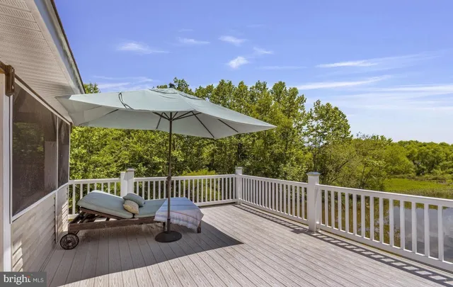 a view of a chairs and table in patio