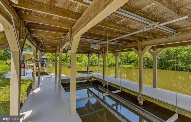 a view of a lake with houses in the back