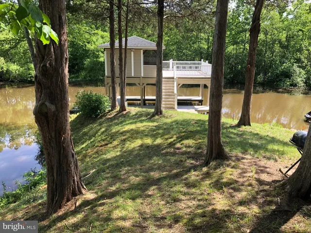 a view of hallway with wooden floor