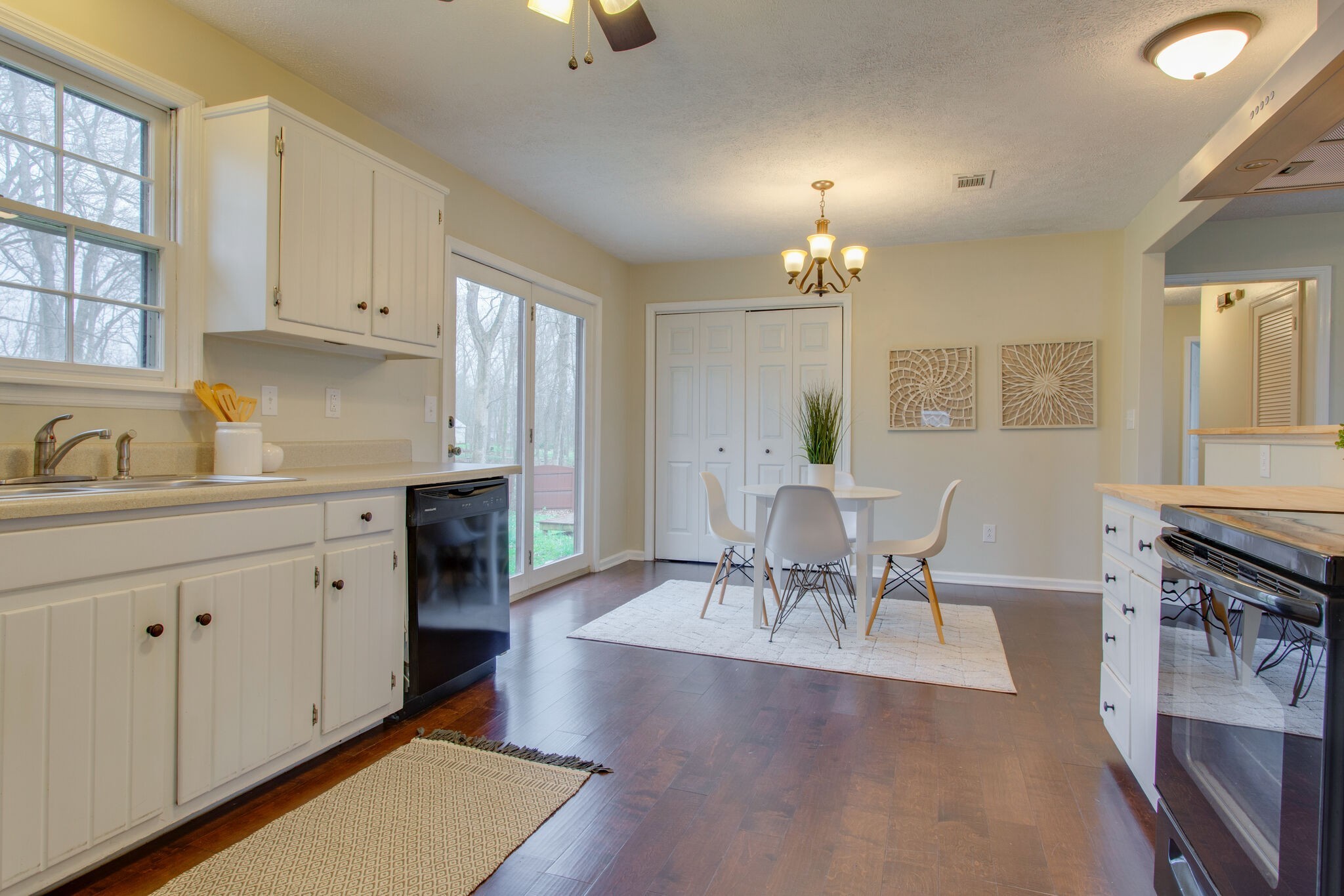 416 Karstridge Road Smyrna, TN 37167 - Photo 12 of 25 a living room with furniture a dining table and a chandelier