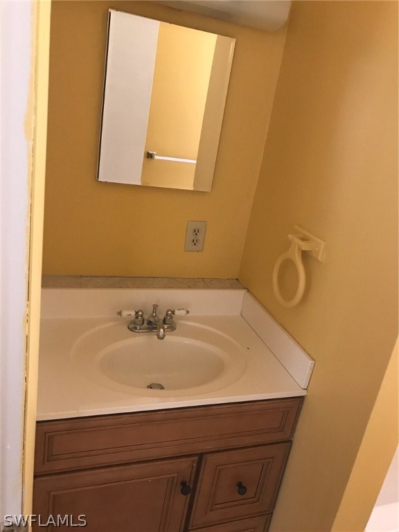 12631 Fourth Street Fort Myers, FL 33905 - Photo 11 of 16 a bathroom with a sink and a mirror