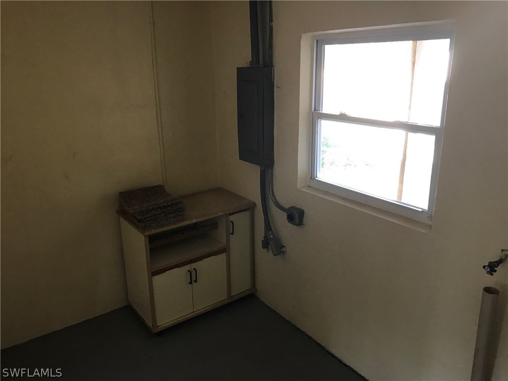 12631 Fourth Street Fort Myers, FL 33905 - Photo 12 of 16 a room with a bed and a window