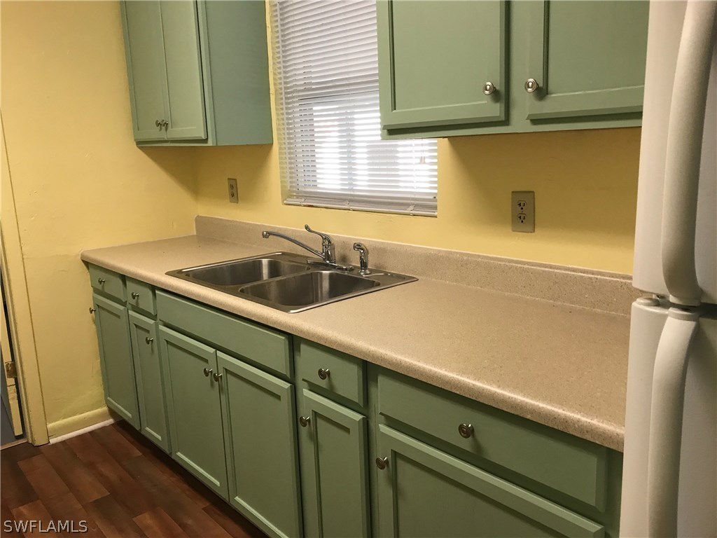 12631 Fourth Street Fort Myers, FL 33905 - Photo 2 of 16 a kitchen with a sink and cabinets